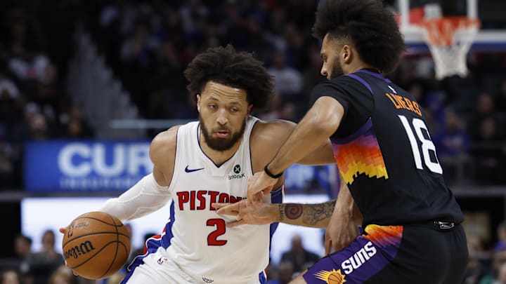 Jan 15, 2026; Detroit, Michigan, USA; Detroit Pistons guard Cade Cunningham (2) dribbles defended by Phoenix Suns forward Isaiah Livers (18) in the second half at Little Caesars Arena. Mandatory Credit: Rick Osentoski-Imagn Images Jan 15, 2026; Detroit, Michigan, USA; Detroit Pistons guard Cade Cunningham (2) dribbles defended by Phoenix Suns forward Isaiah Livers (18) in the second half at Little Caesars Arena. Mandatory Credit: Rick Osentoski-Imagn Images