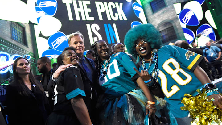 NFL Commisioner Roger Goodell poses with Jaguars fans during the first round of the NFL Draft in 2019.