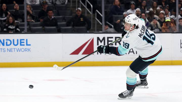 Feb 4, 2026; Los Angeles, California, USA;  Seattle Kraken left wing Jared McCann (19) shoots the puck during the third period against the Los Angeles Kings at Crypto.com Arena. Mandatory Credit: Kiyoshi Mio-Imagn Images