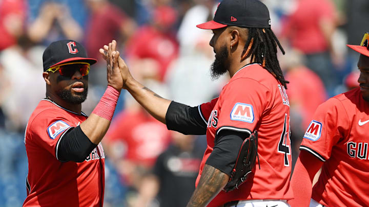 Jun 11, 2025; Cleveland, Ohio, USA; Cleveland Guardians relief pitcher Emmanuel Clase, middle, celebrates with first baseman Carlos Santana, left, after the Guardians beat the Cincinnati Reds at Progressive Field. Mandatory Credit: Ken Blaze-Imagn Images Jun 11, 2025; Cleveland, Ohio, USA; Cleveland Guardians relief pitcher Emmanuel Clase, middle, celebrates with first baseman Carlos Santana, left, after the Guardians beat the Cincinnati Reds at Progressive Field. Mandatory Credit: Ken Blaze-Imagn Images