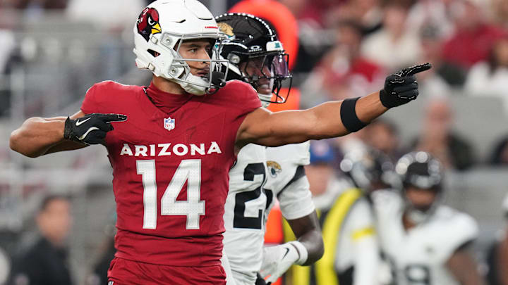 Arizona Cardinals receiver Michael Wilson (14) signals a first down after his catch against the Jacksonville Jaguars at State Farm Stadium on Nov. 23, 2025.