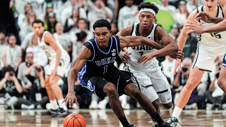 Michigan State guard Jeremy Fears Jr. (1) defends Duke guard Caleb Foster (1) during the second half at Breslin Center in East Lansing on Saturday, Dec. 6, 2025.