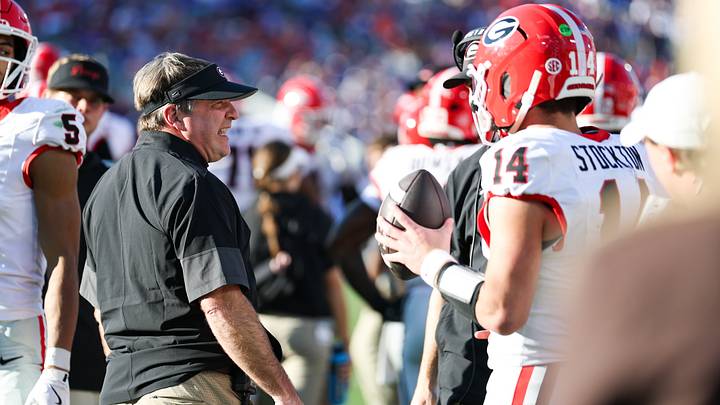 Nov 1, 2025; Jacksonville, Florida, USA; Georgia Bulldogs head coach Kirby Smart speaks with quarterback Gunner Stockton (14) during the second quarter against the Florida Gators at EverBank Stadium. Mandatory Credit: Matt Pendleton-Imagn Images
