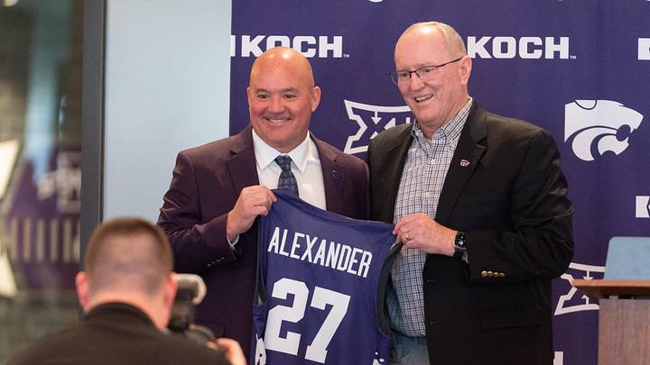 Casey Alexander is given a jersey by Kansas State Athletic Director Gene Taylor as he's welcomed as the new head coach of the Kansas State men’s basketball team during a press conference at Bramlage Coliseum on Monday, March 16, 2026.