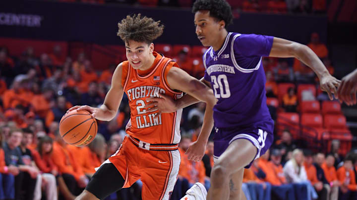 Feb 4, 2026; Champaign, Illinois, USA;  Illinois Fighting Illini guard Keaton Wagler (23) drives past Northwestern Wildcats guard Justin Mullins (20) during the first half at State Farm Center. Mandatory Credit: Ron Johnson-Imagn Images