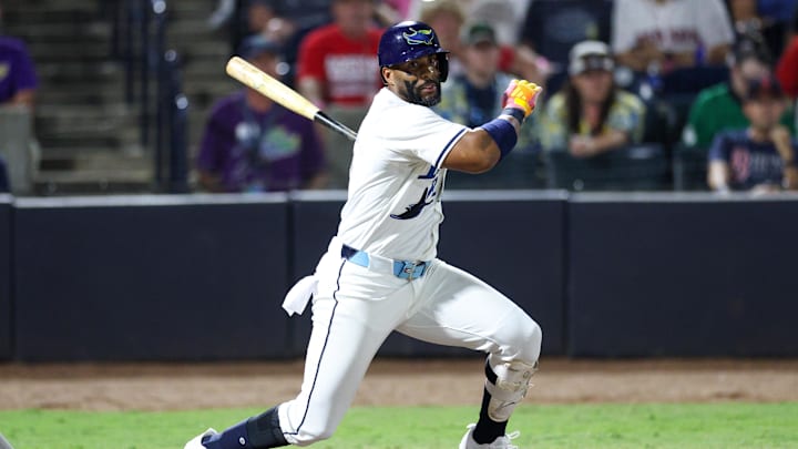 Sep 20, 2025; Tampa, Florida, USA; Tampa Bay Rays first baseman Yandy Diaz (2) hits an rbi single against the Boston Red Sox in the seventh inning at George M. Steinbrenner Field. 