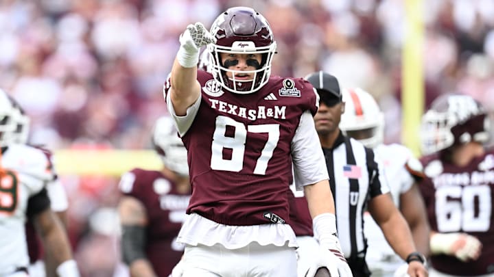 Dec 20, 2025; College Station, TX, USA; Texas A&M Aggies tight end Nate Boerkircher (87) celebrates a first down against the Miami Hurricanes during first quarter of the first round game of the CFP National Playoff at Kyle Field. Mandatory Credit: Maria Lysaker-Imagn Images