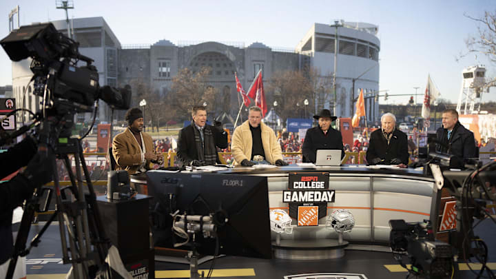 ESPN cast, from left, Desmond Howard, Rece Davis, Pat McAfee, Nick Saban, Lee Corso and Kirk Herbstreit sit on the set of College GameDay prior to the College Football Playoff first round game between the Ohio State Buckeyes and Tennessee Volunteers in Columbus on Dec. 21, 2024.