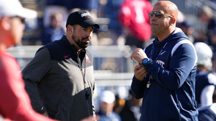 Ohio State coach Ryan Day talks to Penn State coach James Franklin before a 2022 game at Beaver Stadium. Day owns a 6-0 record against Franklin.