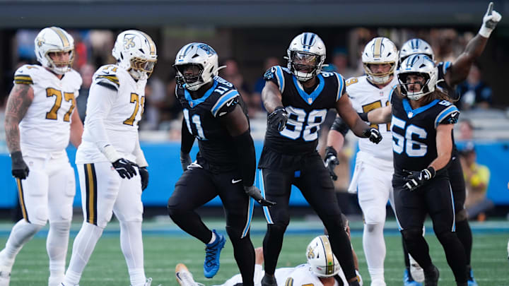 Nov 9, 2025; Charlotte, North Carolina, USA; Carolina Panthers linebacker Nic Scourton (11) celebrates a sack during the fourth quarter against the New Orleans Saints at Bank of America Stadium. Mandatory Credit: Jim Dedmon-Imagn Images