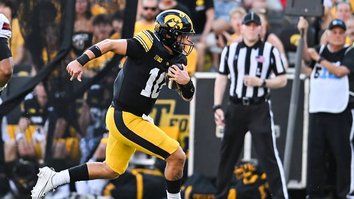Sep 5, 2026; Iowa City, Iowa, USA;  Iowa Hawkeyes quarterback Jeremy Hecklinski (10) scrambles with the ball against the Northern Illinois Huskies during the third quarter at Kinnick Stadium.  Mandatory Credit: Jeffrey Becker-Imagn Images