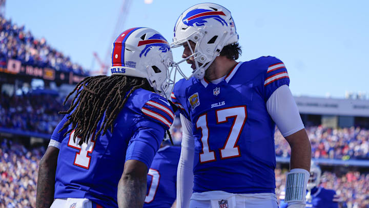 Oct 20, 2024; Orchard Park, New York, USA; Buffalo Bills quarterback Josh Allen (17) congratulates Buffalo Bills running back James Cook (4) for scoring a touchdown against the Tennessee Titans during the first half at Highmark Stadium. Mandatory Credit: Gregory Fisher-Imagn Images