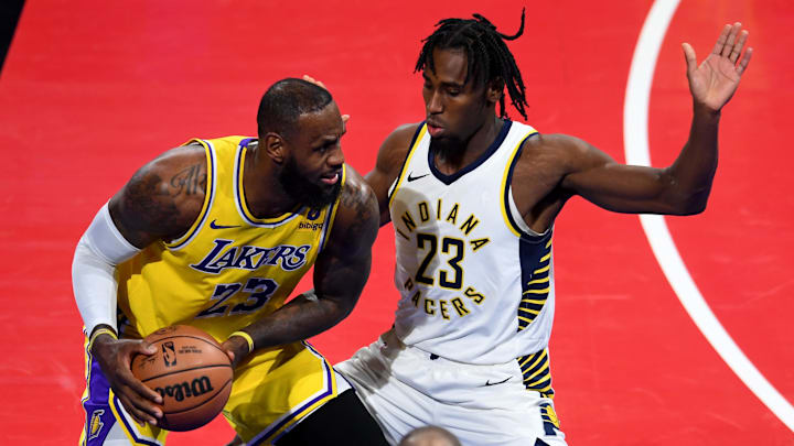Dec 9, 2023; Las Vegas, Nevada, USA; Los Angeles Lakers forward LeBron James (23) keeps the ball from Indiana Pacers forward Aaron Nesmith (23) during the third quarter during the NBA In-Season Tournament Championship game at T-Mobile Arena. Mandatory Credit: Candice Ward-USA TODAY Sports