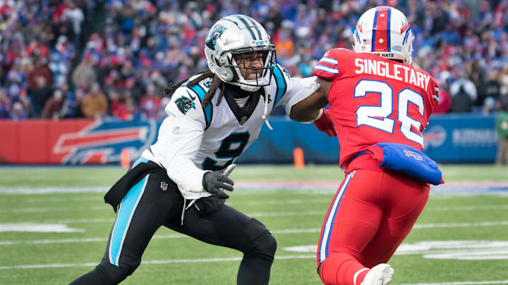 Dec 19, 2021; Orchard Park, New York, USA; Carolina Panthers cornerback Stephon Gilmore (9) and Buffalo Bills running back Devin Singletary (26) in the fourth quarter at Highmark Stadium. Mandatory Credit: Mark Konezny-Imagn Images