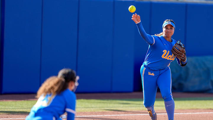 UCLA infielder Jordan Woolery (15) fields ands throws to first base in the first inning during a softball game between Texas Tech and UCLA at the Women’s College World Series at Devon Park in Oklahoma City, on Saturday, May 31, 2025.