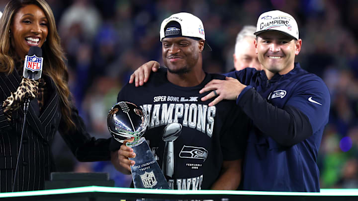 Feb 8, 2026; Santa Clara, CA, USA; Seattle Seahawks head coach Mike MacDonald and running back Kenneth Walker III (9) celebrate with the Vince Lombardi trophy after defeating the New England Patriots in Super Bowl LX at Levi's Stadium. Mandatory Credit: Mark J. Rebilas-Imagn Images