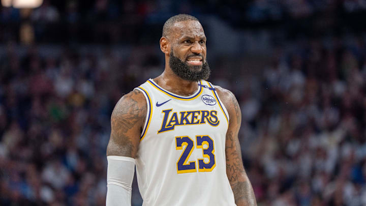 Apr 27, 2025; Minneapolis, Minnesota, USA; Los Angeles Lakers forward LeBron James (23) talks with a referee in the third quarter against the Minnesota Timberwolves during game four of first round for the 2025 NBA Playoffs at Target Center. Mandatory Credit: Matt Blewett-Imagn Images