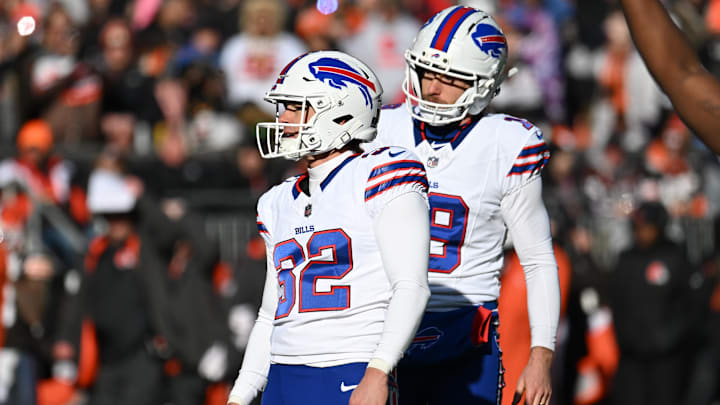 Dec 21, 2025; Cleveland, Ohio, USA;  Buffalo Bills kicker Michael Badgley (32) watches his missed extra point with holder Mitch Wishnowsky (19) during the first half against the Cleveland Browns at Huntington Bank Field.