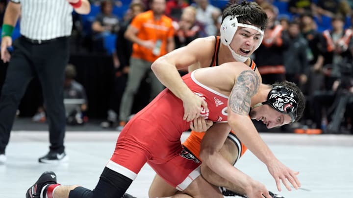 Oklahoma State's Ronnie Ramirez wrestles NC State's Zach Redding at 133 pounds during the National Duals Invitational at the BOK Center in Tulsa, Okla, Saturday, Nov. 15, 2025. Oklahoma State's Ronnie Ramirez wrestles NC State's Zach Redding at 133 pounds during the National Duals Invitational at the BOK Center in Tulsa, Okla, Saturday, Nov. 15, 2025.