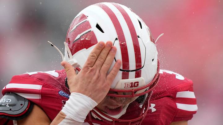 Wisconsin Badgers running back Harrison Bortolotti (32) slaps his helmet during the third quarter against the Eastern Michigan Eagles. Wisconsin Badgers running back Harrison Bortolotti (32) slaps his helmet during the third quarter against the Eastern Michigan Eagles.