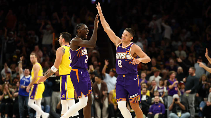 Feb 26, 2026; Phoenix, Arizona, USA; Phoenix Suns guard Grayson Allen (8) celebrates with forward Rasheer Fleming (20) against the Los Angeles Lakers in the second half at Mortgage Matchup Center. Mandatory Credit: Mark J. Rebilas-Imagn Images