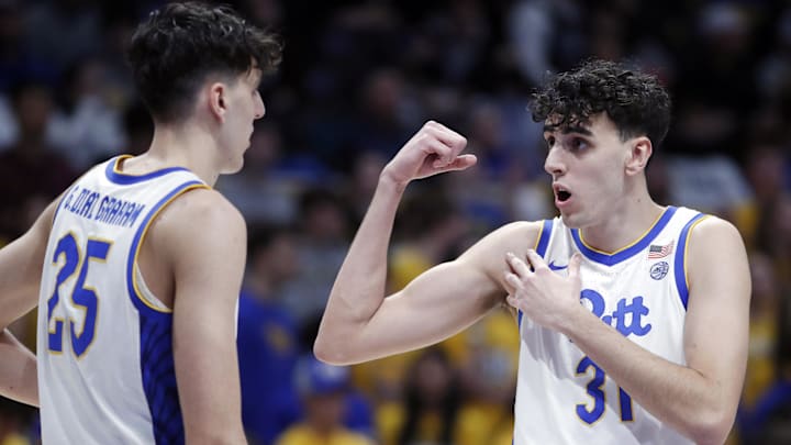 Jan 9, 2024; Pittsburgh, Pennsylvania, USA; Pittsburgh Panthers forward Guillermo Diaz Graham (25) listens to his twin brother forward Jorge Diaz Graham (31) against the Duke Blue Devils during the first half at the Petersen Events Center. Mandatory Credit: Charles LeClaire-Imagn Images Jan 9, 2024; Pittsburgh, Pennsylvania, USA; Pittsburgh Panthers forward Guillermo Diaz Graham (25) listens to his twin brother forward Jorge Diaz Graham (31) against the Duke Blue Devils during the first half at the Petersen Events Center. Mandatory Credit: Charles LeClaire-Imagn Images