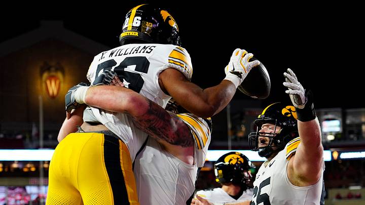 Iowa Hawkeyes offensive lineman Gennings Dunker (67) lifts running back Xavier Williams (26), celebrating the touchdown during the second half of the game against the Wisconsin Badgers on Saturday October 11, 2025 at Camp Randall in Madison, Wisconsin. Iowa Hawkeyes offensive lineman Gennings Dunker (67) lifts running back Xavier Williams (26), celebrating the touchdown during the second half of the game against the Wisconsin Badgers on Saturday October 11, 2025 at Camp Randall in Madison, Wisconsin.
