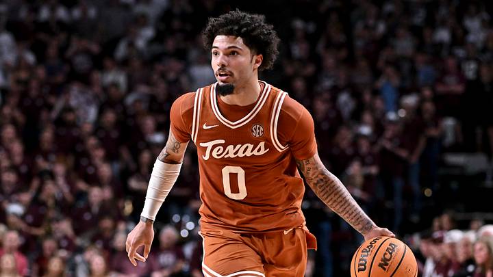 Texas Longhorns guard Jordan Pope (0) dribbles the ball during the first half against the Texas A&M Aggies at Reed Arena. 