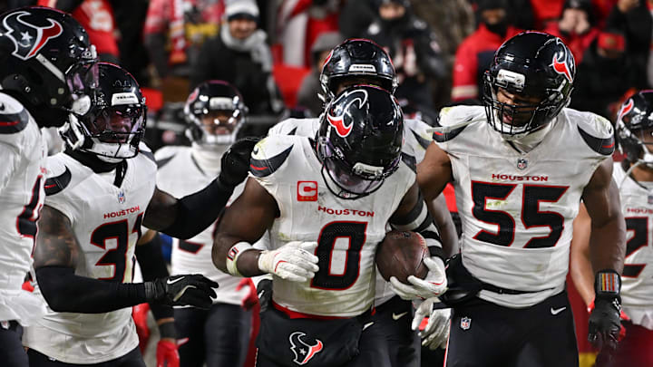 Dec 7, 2025; Kansas City, Missouri, USA; Houston Texans linebacker Azeez Al-Shaair (0) celebrates with his teammates after an interception during the fourth quarter against the Kansas City Chiefs at GEHA Field at Arrowhead Stadium. Mandatory Credit: Amy Kontras-Imagn Images