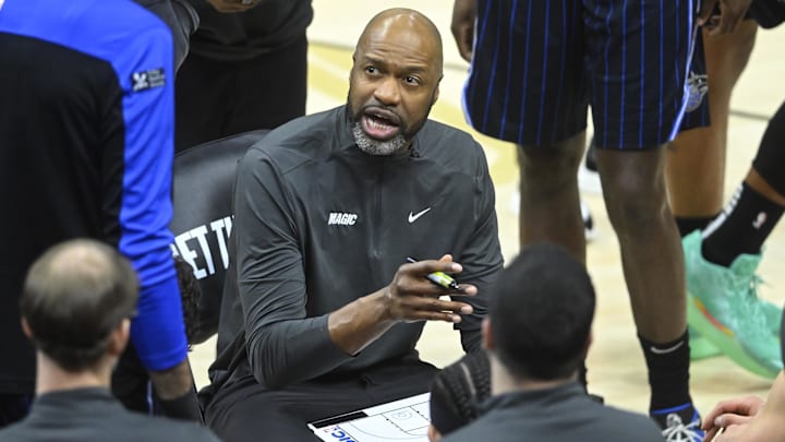 Mar 16, 2025; Cleveland, Ohio, USA; Orlando Magic head coach Jamahl Mosley talks to his team during a timeout in the third quarter     against the Cleveland Cavaliers at Rocket Arena. Mandatory Credit: David Richard-Imagn Images