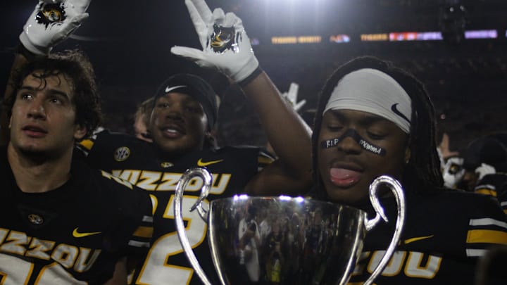 Sept 20, 2025; Columbia, Missouri, USA; Missouri Tigers wide receiver Marquis Johnson celebrates with the trophy after the Tiger's win over South Carolina.