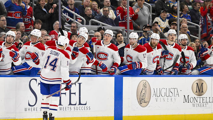Mar 25, 2025; St. Louis, Missouri, USA; Montreal Canadiens center Nick Suzuki (14) is congratulated by teammates after scoring against the St. Louis Blues during the first period at Enterprise Center. Mandatory Credit: Jeff Curry-Imagn Images Mar 25, 2025; St. Louis, Missouri, USA; Montreal Canadiens center Nick Suzuki (14) is congratulated by teammates after scoring against the St. Louis Blues during the first period at Enterprise Center. Mandatory Credit: Jeff Curry-Imagn Images