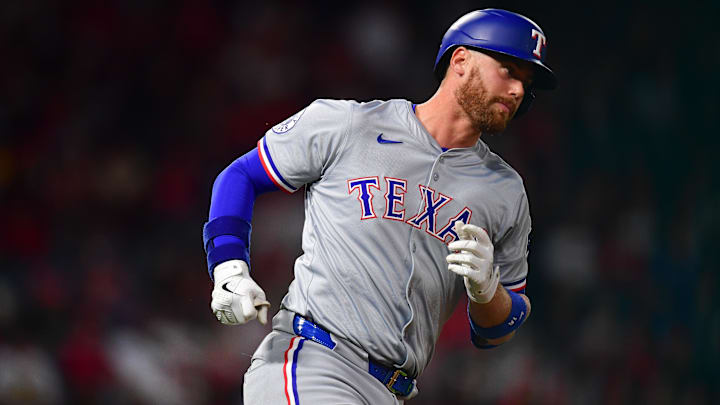 Sep 27, 2024; Anaheim, California, USA; Texas Rangers designated hitter Carson Kelly (18) runs the bases after hitting a solo home run against the Los Angeles Angels during the fourth inning at Angel Stadium.