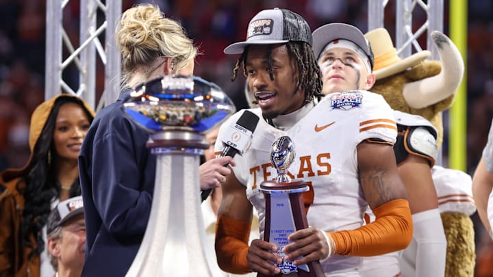 Texas Longhorns defensive back Jahdae Barron receives the most outstanding player award after a victory over Arizona State.
