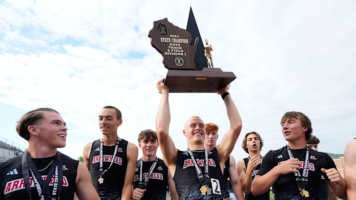 Members of the Arrowhead High School boys track and field team hoist the 2024 WIAA Division 1 state championship trophy on Saturday June 1, 2024 at Veterans Memorial Stadium Complex in La Crosse, Wis.