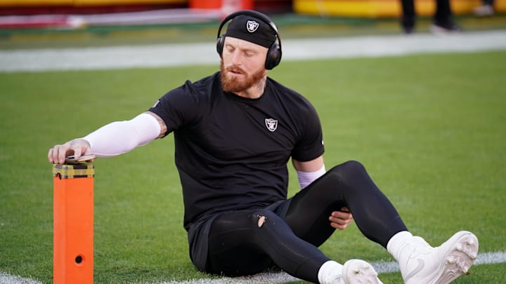 Oct 19, 2025; Kansas City, Missouri, USA; Las Vegas Raiders defensive end Maxx Crosby (98) stretches during warmups prior to the game against the Kansas City Chiefs at GEHA Field at Arrowhead Stadium. Mandatory Credit: Denny Medley-Imagn Images