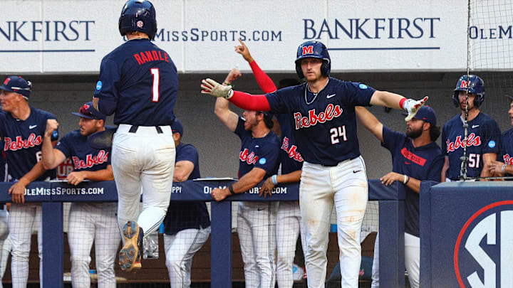 Jun 2, 2025; Oxford, MS, USA; Mississippi Rebels catcher Austin Fawley (24) reacts with  shortstop Brayden Randle (1), after Randle scored during the seventh inning against the Murray State Racers. Mandatory Credit: Petre Thomas-Imagn Images