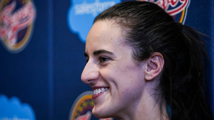 Indiana Fever guard Caitlin Clark (22) smiles while answering a question Tuesday, Sept. 17, 2024, after an Indiana Fever practice at Gainbridge Fieldhouse in Indianapolis.
