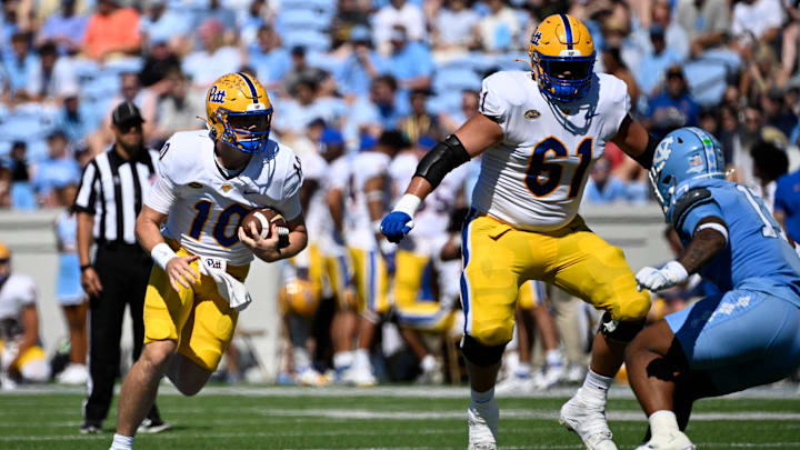 Oct 5, 2024; Chapel Hill, North Carolina, USA; Pittsburgh Panthers quarterback Eli Holstein (10) runs with the ball in the first quarter at Kenan Memorial Stadium. Mandatory Credit: Bob Donnan-Imagn Images