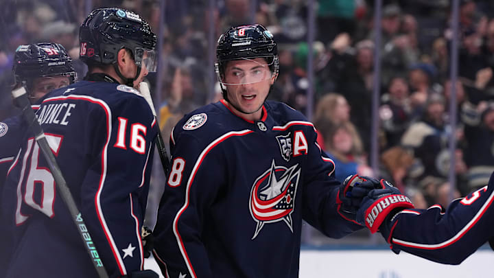 Blue Jackets defenseman Zach Werenski celebrates a goal with his teammates.