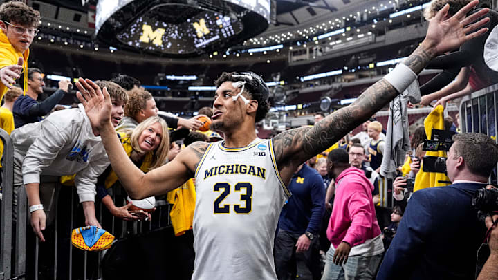 Michigan forward Yaxel Lendeborg high-five fans as he exits the court after winning the NCAA Tournament Midwest Regional Championship by 95-62 win over Tennessee at United Center in Chicago on Sunday, March 29, 2026. Michigan forward Yaxel Lendeborg high-five fans as he exits the court after winning the NCAA Tournament Midwest Regional Championship by 95-62 win over Tennessee at United Center in Chicago on Sunday, March 29, 2026.