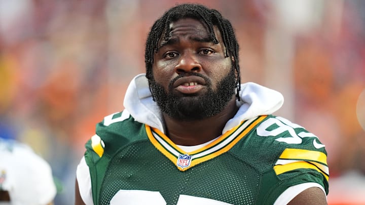 Aug 18, 2024; Denver, Colorado, USA; Green Bay Packers defensive tackle Devonte Wyatt (95) during the second quarter against the Denver Broncos at Empower Field at Mile High. Mandatory Credit: Ron Chenoy-Imagn Images