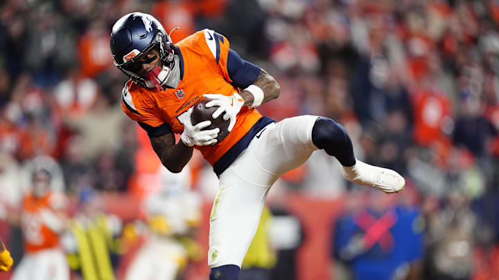 Dec 14, 2025; Denver, Colorado, USA: Denver Broncos wide receiver Troy Franklin (11) celebrates following a touchdown during the third quarter against the Green Bay Packers at Empower Field at Mile High. Mandatory Credit: Ron Chenoy-Imagn Images
