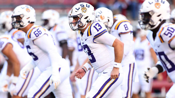 Oct 19, 2024; Fayetteville, Arkansas, USA; LSU Tigers quarterback Garrett Nussmeier (13) warms up prior to a game against the Arkansas Razorbacks at Donald W. Reynolds Razorback Stadium. Mandatory Credit: Nelson Chenault-Imagn Images Oct 19, 2024; Fayetteville, Arkansas, USA; LSU Tigers quarterback Garrett Nussmeier (13) warms up prior to a game against the Arkansas Razorbacks at Donald W. Reynolds Razorback Stadium. Mandatory Credit: Nelson Chenault-Imagn Images