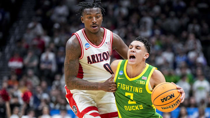 Mar 23, 2025; Seattle, WA, USA;  Oregon Ducks guard Jackson Shelstad (3) dribbles the ball against Arizona Wildcats guard Jaden Bradley (0) in the second half at Climate Pledge Arena. Mandatory Credit: Stephen Brashear-Imagn Images