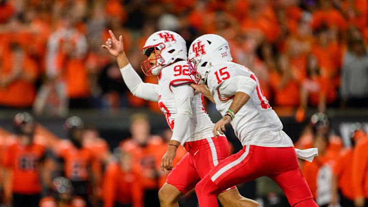 Houston Cougars place kicker Ethan Sanchez celebrates his winning field goal kick in overtime with quarterback Jake Sock against the Oregon State Beavers at Reser Stadium. Houston Cougars place kicker Ethan Sanchez celebrates his winning field goal kick in overtime with quarterback Jake Sock against the Oregon State Beavers at Reser Stadium.