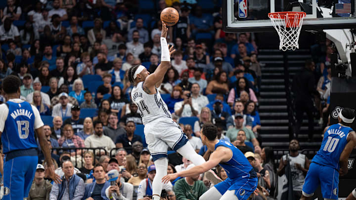 Orlando Magic guard Gary Harris (14) shoots the ball over Dallas Mavericks guard Dante Exum (00) in the second quarter at Kia Center.
