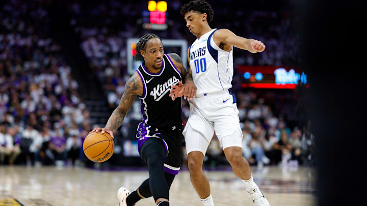 Apr 16, 2025; Sacramento, California, USA; Sacramento Kings forward DeMar DeRozan (10) dribbles the ball against Dallas Mavericks guard Max Christie (00) during the fourth quarter at Golden 1 Center. Mandatory Credit: Sergio Estrada-Imagn Images