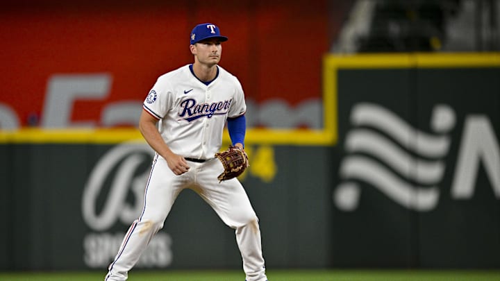 Apr 5, 2024; Arlington, Texas, USA; Texas Rangers second base Justin Foscue (56) makes his major league debut during the eighth inning against the Houston Astros at Globe Life Field. Mandatory Credit: Jerome Miron-Imagn Images