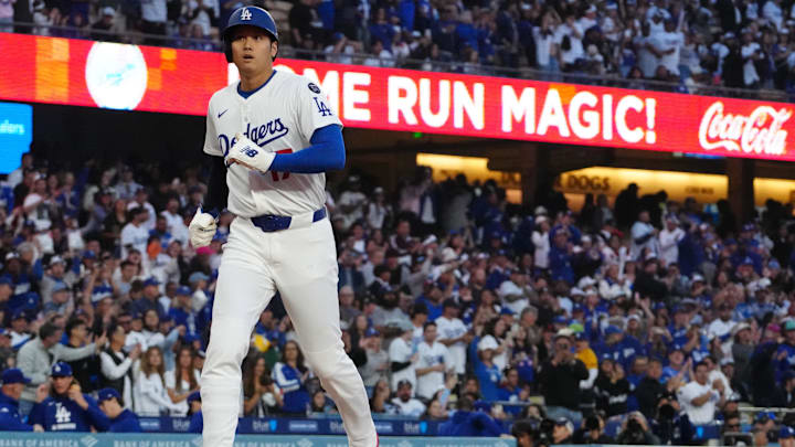Apr 14, 2025; Los Angeles, California, USA; Los Angeles Dodgers designated hitter Shohei Ohtani (17) scores on a two-run home run by shortstop Mookie Betts (not pictured) in the first inning against the Colorado Rockies at Dodger Stadium. Mandatory Credit: Kirby Lee-Imagn Images